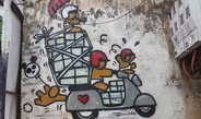 <p>Motorbikes and scooters are an important means of transport and mobility in contemporary Vietnam. This wall painting in the old quarter of Hanoi may seem a bit exaggerated, but it is in fact not all too far from the reality of everyday street life. The only exception: so far children below the age of six have not been required by law to wear a helmet.<br /><br />Photo: Kirsten Endres, Hanoi, Vietnam, 2013<br />Max Planck Institute for Social Anthropology</p>