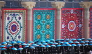 <p>State celebrations of <em>Navruz</em>, the Persian New Year. The central ceremony was held at the hippodrome in the presence of the Tajik president. Students of local universities standing in front of images of traditional <em>suzanies</em>, embroidered fabrics with patterns characteristic for various regions.<br /><br />Photo: Małgorzata Biczyk, Dushanbe, Tajikistan, 2011<br />Max Planck Institute for Social Anthropology</p>
