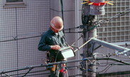 <p>Supply lines getting serviced in Kyoto. As in other Japanese cities, transformers and a dense maze of wires are suspended above the streets rather than placed on the sidewalks for the lack of space.<br /><br />Photo: Christoph Brumann, Kyoto, Japan, 2011<br />Max Planck Institute for Social Anthropology</p>