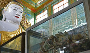 <p>Donation boxes in Soon U Ponya Shin Pagoda, Sagaing, with the Pagoda’s main Buddha statue in the background. Sagaing is the religious centre of Myanmar. It hosts thousands of monks and nuns who study and meditate in the countless Buddhist monasteries. The Pagodas of Sagaing also attract many pilgrims and foreign visitors.<br /><br />Photo: Laura Hornig, Sagaing, Myanmar, 2016<br />Max Planck Institute for Social Anthropology</p>