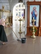 Cleaning the church in Holy Trinity St.Sergius Lavra, Russia