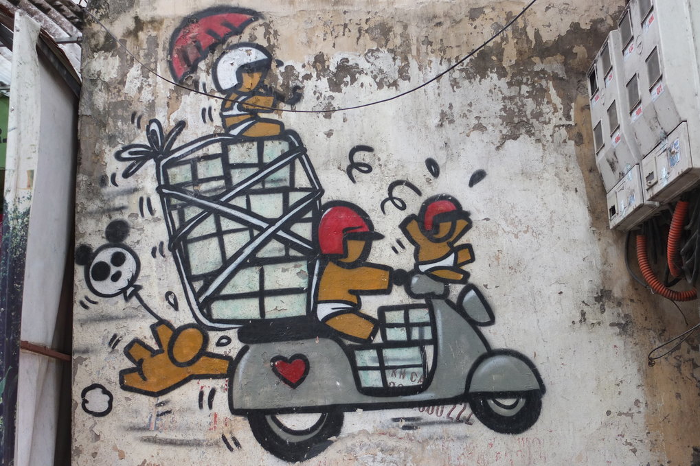 <p>Motorbikes and scooters are an important means of transport and mobility in contemporary Vietnam. This wall painting in the old quarter of Hanoi may seem a bit exaggerated, but it is in fact not all too far from the reality of everyday street life. The only exception: so far children below the age of six have not been required by law to wear a helmet.<br /><br />Photo: Kirsten Endres, Hanoi, Vietnam, 2013<br />Max Planck Institute for Social Anthropology</p>