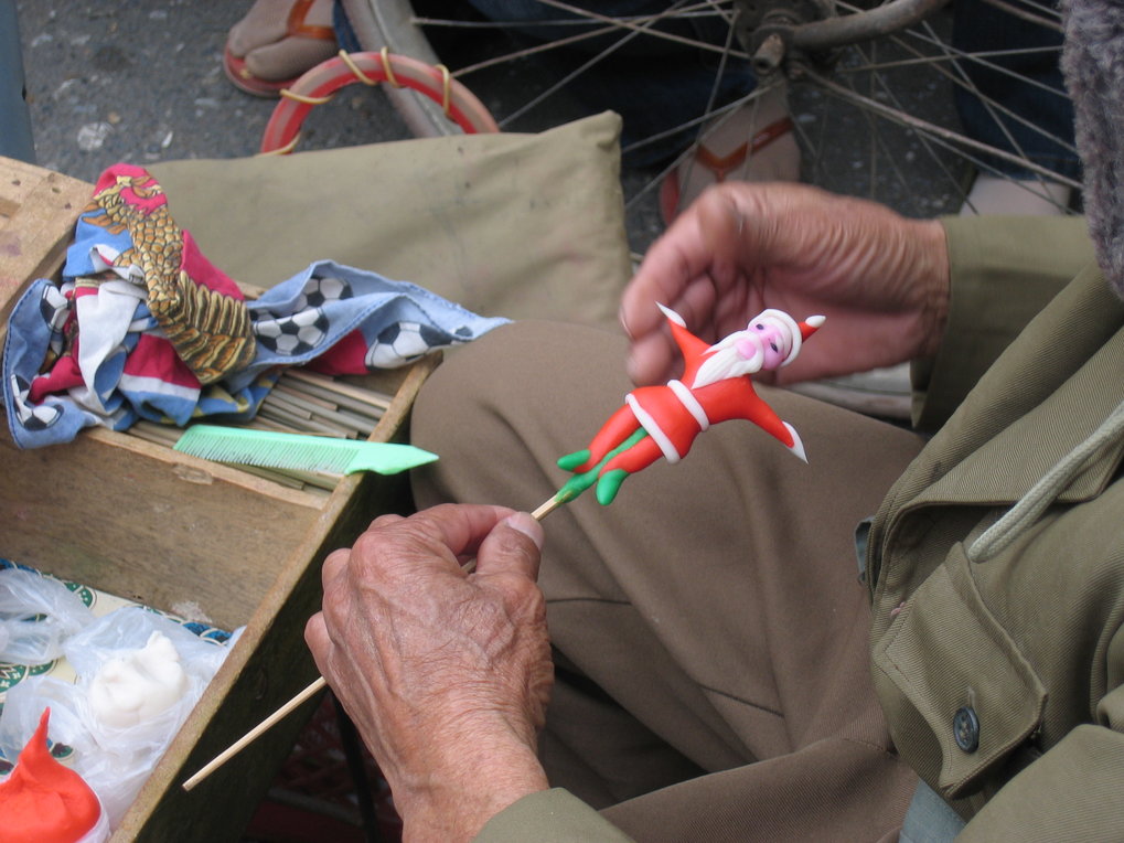 <p>Sugar paste sculpting requires nimble hands and an eye for detail. Sitting on the square outside Saint Joseph’s Cathedral in Hanoi, an old man earns a small income from selling Santa Claus figurines during the Christmas season.<br /><br />Photo: Kirsten Endres, Hanoi, Vietnam, 2010<br />Max Planck Institute for Social Anthropology</p>