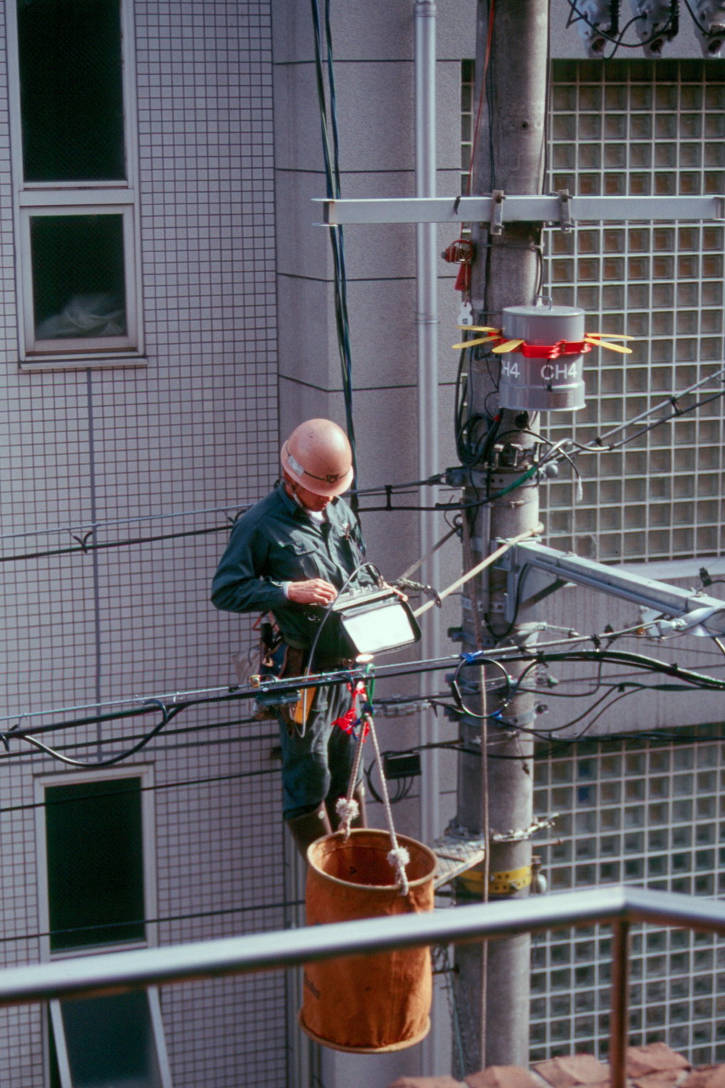 <p>Supply lines getting serviced in Kyoto. As in other Japanese cities, transformers and a dense maze of wires are suspended above the streets rather than placed on the sidewalks for the lack of space.<br /><br />Photo: Christoph Brumann, Kyoto, Japan, 2011<br />Max Planck Institute for Social Anthropology</p>