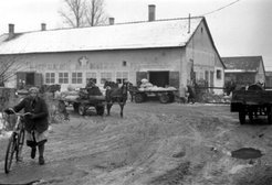 Villagers purchasing supplies from the socialist institution, to use in their private production.