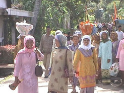 Women bring fruit for installation ceremony of traditional family heads in the village Talang Anau.