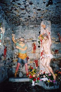 Christ's flagellation as represented at the Lichen "Golgotha". While most intellectuals, including some elements within the Polish Roman Catholic Church, dismiss the religious art of Lichen as "kitsch", there is no doubting its appeal to the great majority of the pilgrims.
