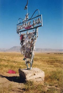 In rural Kazakhstan the tying of votive rags at shrines and other sacred sites is a conspicuous sign of popular religion. The picture on the right shows a natural beauty spot where seven streams meet. There is no saintly tomb but the waters are believed to have healing power. Pilgrims pray there and most visitors take full baths.