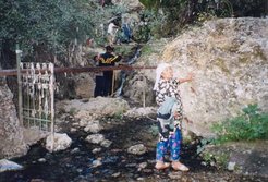 In rural Kazakhstan the tying of votive rags at shrines and other sacred sites is a conspicuous sign of popular religion. The picture on the right shows a natural beauty spot where seven streams meet. There is no saintly tomb but the waters are believed to have healing power. Pilgrims pray there and most visitors take full baths.