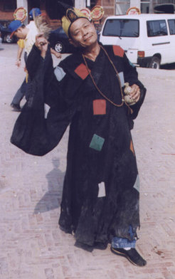 Taiwanese spirit medium possessed by the "Living Buddha Lord Ji" (Jigong Huofo 濟公活佛), a trickster figure from the Chinese popular pantheon. Xinying, Taiwan September 2002