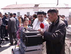 Preparing for the show: a singer has the technical equipment checked before he starts his performance during a local festival. Kosh-Agach, Republic of Altai, May 2006 © Agnieszka Halemba.