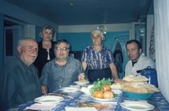 The head of the new farmers association (far left), and his wife (standing second from the right) with the DFID official from Tbilisi (sitting, second from the left)
