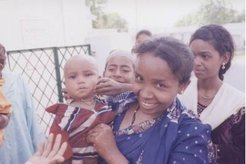 The researcher with the family of the informant.