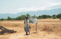 A signpost directing drivers to a police checkpoint in Hor country, Tabya
