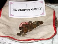 Inside the church, money is given as ‘sacrifice’. Here ‘for the common candle’.