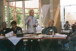 Aidan Southall (standing) in conversation with James Woodburn at the Halle conference, June 2001.