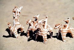 Clay figures of horsemen with and without guns are sold on the markets as toys for children.