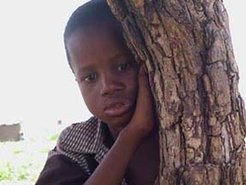A Fulani boy watching the anthropologist.