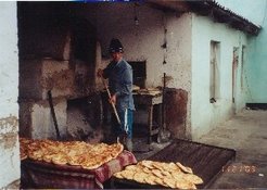 A migrant worker from Uzbekistan, Fergana in a small private bakery in Turkestan, South Kazakhstan, November 2003