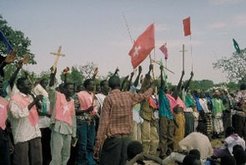 Nuer youth quires celebrating Christmas in the Refugee camp Pinyudo, December 2001.