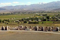 The clash of descent and agency. In a Kyrgyz cemetery (foreground) the extravagance of a tomb reveals either the high genealogical status of those buried there or the present economic power of their descendants. The village (in the background) is the arena of a similar confrontation between those who are proud in their descent and those who are proud in their actions. Village of Moldo Kïlïch, oblast' of Naryn, Kyrgyzstan 2005.