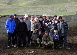 Contrary to the festive meal of mutton, where places and pieces of meat were strictly attributed according to status, for the photo, everyone could freely choose a place. Even the ethnographer is not truly in the centre, although she is distinguished by the newly-born lamb she was allowed to hold in her arms. Tian Shan, Taragay valley, July 2001.