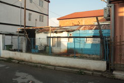 Former accommodation containers sponsored by international organizations delivered after a major earthquake in the 1960s have been transformed into long-term housing structures in Shuto Orizari (Skopje 2014)