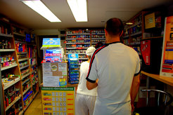 Customers queue up in a National Tobacco Shop.