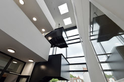 The light-filled atrium and 'floating' stairs and balconies in the Max Planck Institute for Social Anthropology’s extension building.