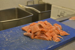 Salmon cut and ready to be packed for delivery. Every day, the fishmonger delivers fresh fish to be cooked and served at public kindergartens and other public institutions.