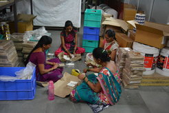 Women sorting labels in a typical small scale enterprise. Maharashtra, India.
