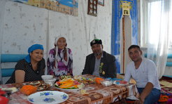 A Mongolian repatriate (wearing a hat) and his “local” wife (left) are hosting his maternal aunt (second from left) and her son (on the right) on their first visit to Kazakhstan