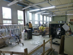 The wheel unit of the bicycle factory. To be eligible for investment support it was necessary that the technology originate in the EU (in this case the brand indicates Holland). In fact the machine on the right, like all the components of the bicycles assembled here, is made in China. (It would in principle be much more profitable to import the final product from China, but the niche which this factory fills results from heavy customs duties - I was told 65% - that are not levied on separate components.)