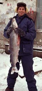 John Ziker holding a large nelma (Stenodus leucichthys) in Ust Avam in 1995. The nelma is rarely caught on the Avam River, only once or twice a year.