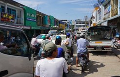 Traffic and shops in downtown Pathein.