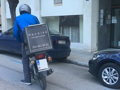 A delivery worker delivers food in locked-down central Athens.