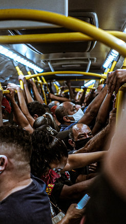 An overcrowded BRT wagon (fast transit bus), in the city of Rio de Janeiro, June 2020. Titled “O Avião do Trabalhador” (“The Worker’s Airplane”).