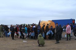 Distribution of water in the camp for migrants nearby Kernel city.