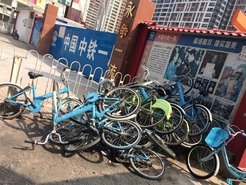 Figure 9: broken shared bikes abandoned outside a subway station construction side, 2018.